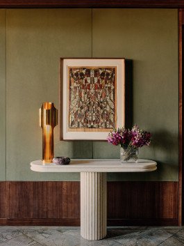 Rosewood Art: Kensington Leverne Photography showcases framed abstract art, flowers, and stylish decor on a marble console table. 