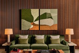 Rosewood Art: Abstract paintings in green and brown hues above a stylish green sofa. Kensington Leverne Photography. 